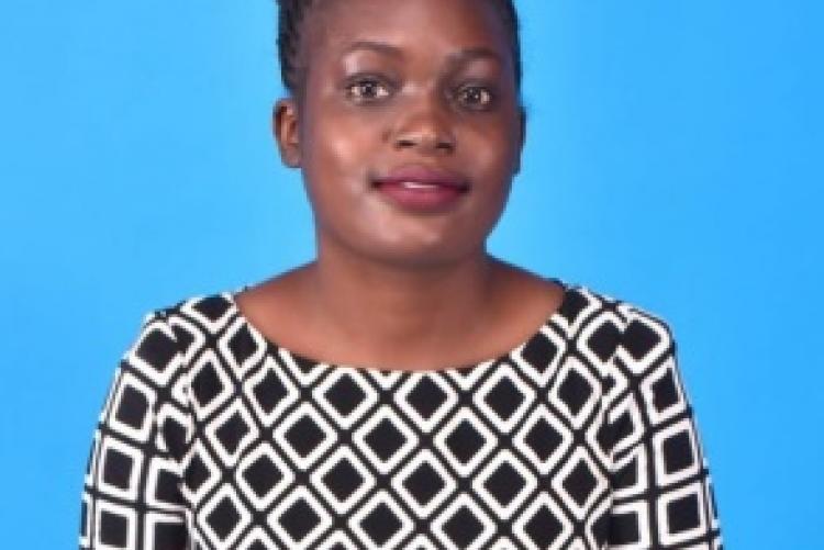 KITUI SHARON ACHARO,  Graduating with Master of Arts Project Planning and Management