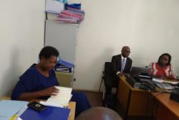 Prof. Harriet J. Kidombo, Deputy Director, Open, Distance and e-Learning (ODeL) Campus perusing through the documents under review as she  leads the team of heads of departments in a consultative meeting on uploading common undergraduate courses. 